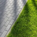 Lawn edge by paving stones